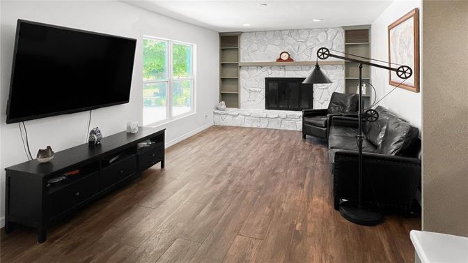 Fireplace, Interior, Living room, Recessed Lighting, Stone Walls, Wood Texture Flooring