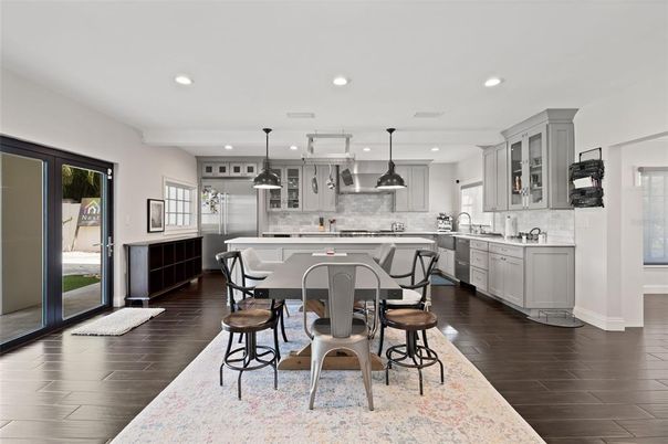 Dining room, Interior, Kitchen, Pendant Lights, Recessed Lighting, Stainless Steel Appliances, Wood Texture Flooring