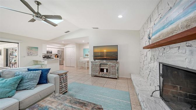 Fireplace, Interior, Kitchen, Living room, Recessed Lighting, Stainless Steel Appliances, Stone Walls