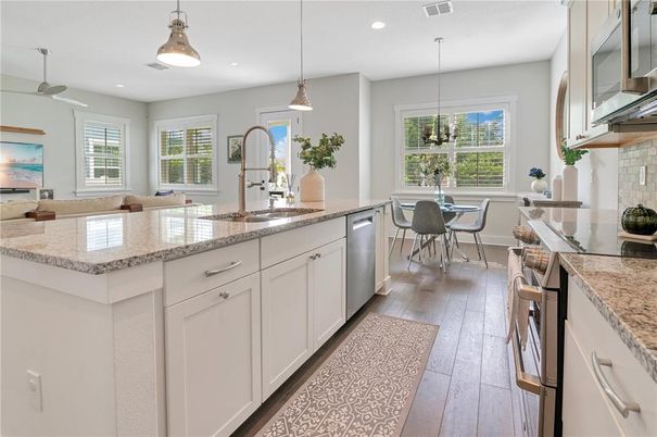 Dining room, Interior, Kitchen, Pendant Lights, Recessed Lighting, Stainless Steel Appliances, Wood Texture Flooring