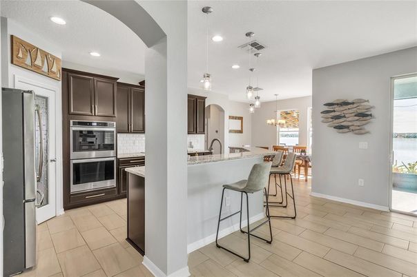 Dining room, Interior, Kitchen, Pendant Lights, Recessed Lighting, Stainless Steel Appliances, Wood Texture Flooring