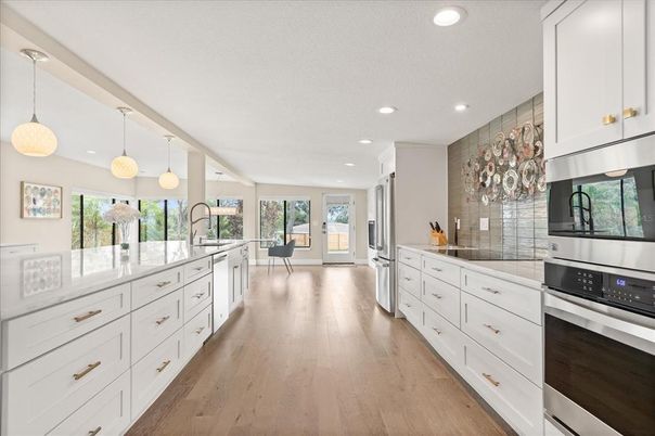 Interior, Kitchen, Pendant Lights, Recessed Lighting, Stainless Steel Appliances, Wood Texture Flooring