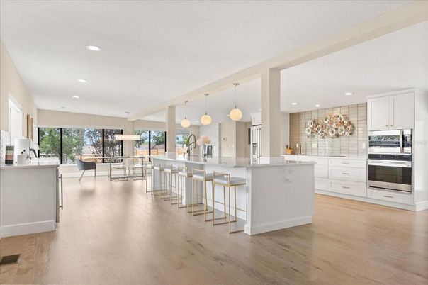 Dining room, Interior, Kitchen, Pendant Lights, Recessed Lighting, Stainless Steel Appliances, Wood Texture Flooring