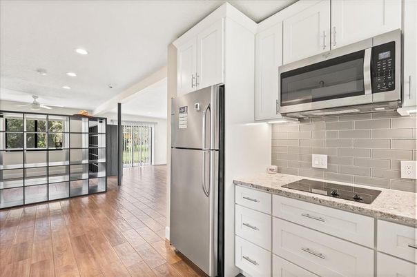 Interior, Kitchen, Recessed Lighting, Stainless Steel Appliances, Wood Texture Flooring