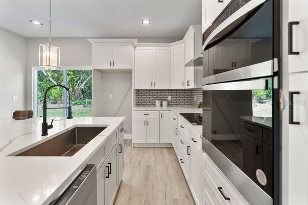 Interior, Kitchen, Pendant Lights, Recessed Lighting, Stainless Steel Appliances, Wood Texture Flooring