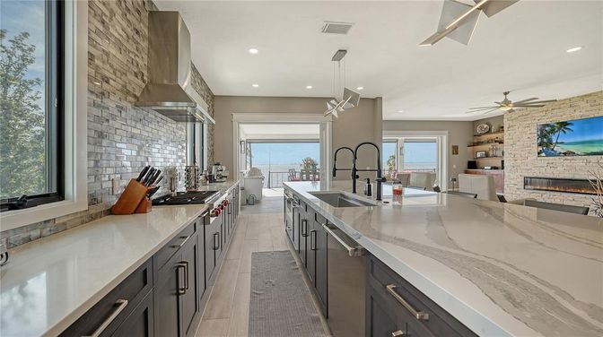Fireplace, Interior, Kitchen, Pendant Lights, Recessed Lighting, Stainless Steel Appliances, Stone Walls