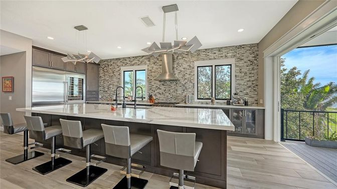 Interior, Kitchen, Pendant Lights, Recessed Lighting, Stainless Steel Appliances, Stone Walls, Wood Texture Flooring