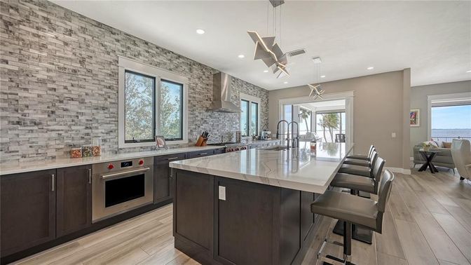 Interior, Kitchen, Pendant Lights, Recessed Lighting, Stainless Steel Appliances, Stone Walls, Wood Texture Flooring