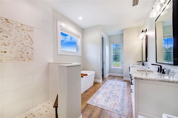 Bathroom, Dual Sink Vanities, Free Standing Baths, Interior, Recessed Lighting, Wood Texture Flooring