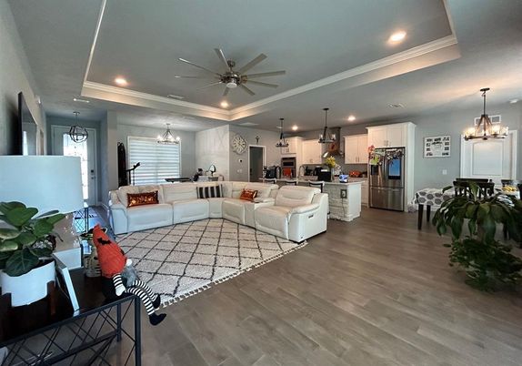 Chandelier, Interior, Kitchen, Living room, Pendant Lights, Recessed Lighting, Stainless Steel Appliances, Wood Texture Flooring