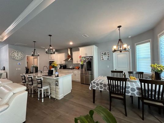 Chandelier, Dining room, Interior, Kitchen, Pendant Lights, Recessed Lighting, Stainless Steel Appliances, Wood Texture Flooring