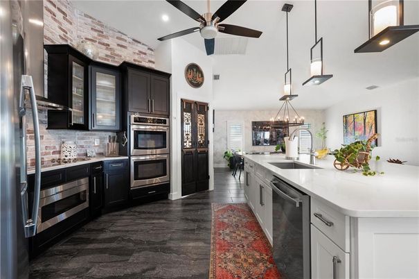 Interior, Kitchen, Pendant Lights, Recessed Lighting, Stainless Steel Appliances, Stone Walls, Wood Texture Flooring