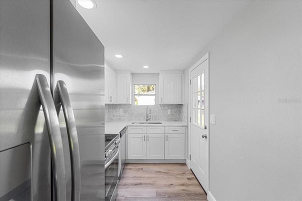 Interior, Kitchen, Recessed Lighting, Stainless Steel Appliances, Wood Texture Flooring