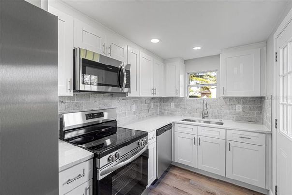 Interior, Kitchen, Recessed Lighting, Stainless Steel Appliances, Wood Texture Flooring