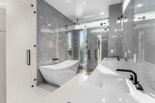 Bathroom, Dual Sink Vanities, Free Standing Baths, Glass Shower, Interior, Marble Walls, Recessed Lighting