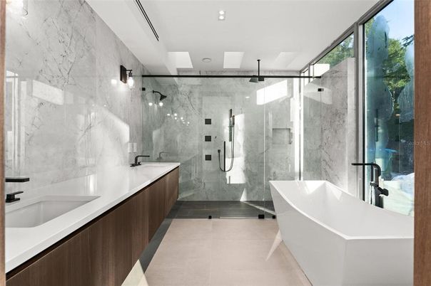Bathroom, Dual Sink Vanities, Free Standing Baths, Glass Shower, Interior, Marble Walls, Recessed Lighting