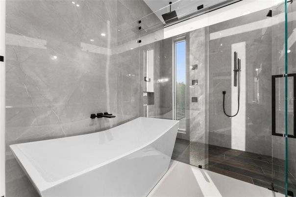 Bathroom, Free Standing Baths, Glass Shower, Interior, Marble Walls, Recessed Lighting