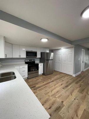Interior, Kitchen, Recessed Lighting, Stainless Steel Appliances, Wood Texture Flooring