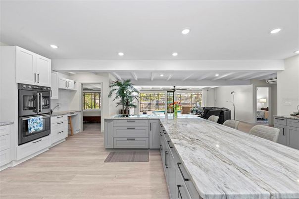 Dining room, Interior, Kitchen, Recessed Lighting, Stainless Steel Appliances, Wood Texture Flooring