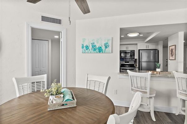 Dining room, Interior, Kitchen, Recessed Lighting, Stainless Steel Appliances, Wood Texture Flooring