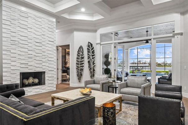 Fireplace, Interior, Living room, Recessed Lighting, Stone Walls, Water, Wood Texture Flooring