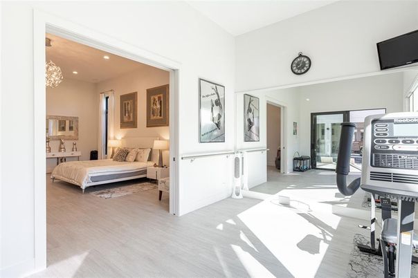 Bedroom, Chandelier, Fitness Equipment, Interior, Recessed Lighting, Wood Texture Flooring