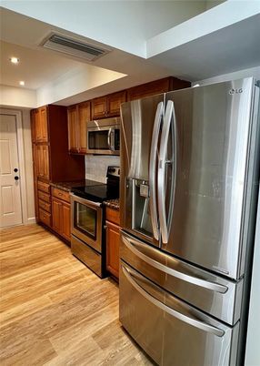 Interior, Kitchen, Recessed Lighting, Stainless Steel Appliances, Wood Texture Flooring