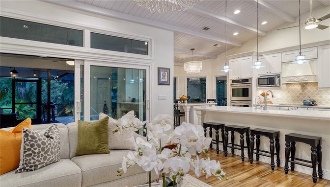 Chandelier, Interior, Kitchen, Living room, Pendant Lights, Recessed Lighting, Stainless Steel Appliances, Wood Texture Flooring