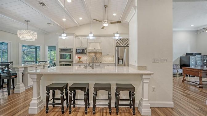Chandelier, Interior, Kitchen, Pendant Lights, Recessed Lighting, Stainless Steel Appliances, Wood Texture Flooring