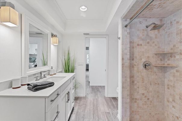 Bathroom, Dual Sink Vanities, Glass Shower, Interior, Recessed Lighting, Wood Texture Flooring