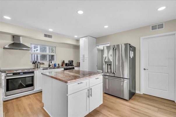 Interior, Kitchen, Recessed Lighting, Stainless Steel Appliances, Wood Texture Flooring
