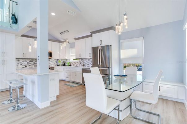 Dining room, Interior, Kitchen, Pendant Lights, Recessed Lighting, Stainless Steel Appliances, Wood Texture Flooring