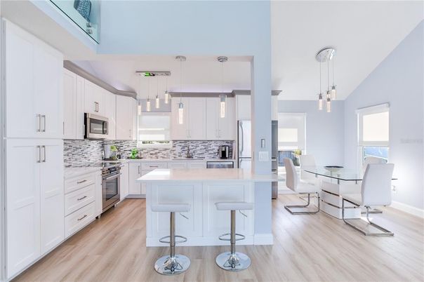 Dining room, Interior, Kitchen, Pendant Lights, Stainless Steel Appliances, Wood Texture Flooring