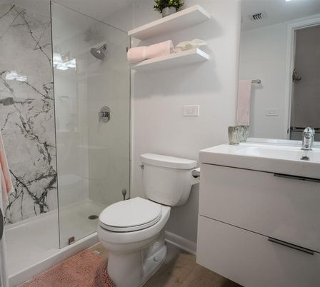 Bathroom, Glass Shower, Interior, Marble Walls, Wood Texture Flooring