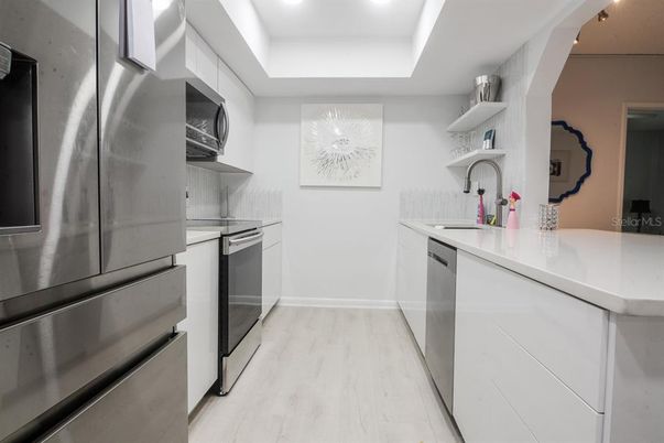 Interior, Kitchen, Recessed Lighting, Stainless Steel Appliances, Wood Texture Flooring