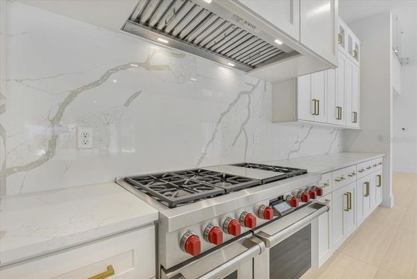 Interior, Kitchen, Marble Walls, Recessed Lighting, Stainless Steel Appliances