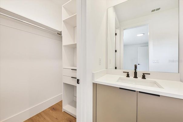 Bathroom, Dual Sink Vanities, Interior, Recessed Lighting, Walk-in Closets, Wood Texture Flooring
