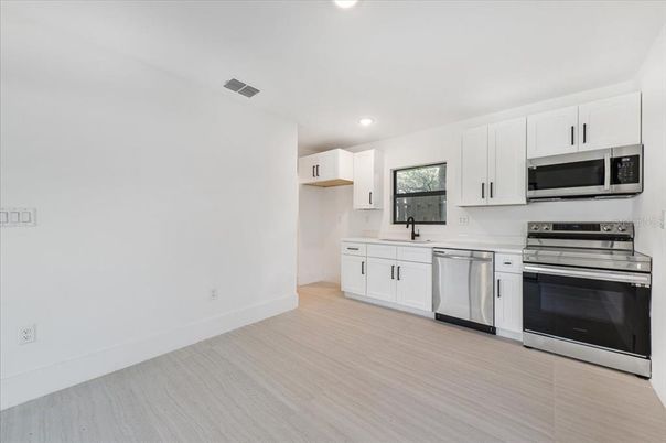 Interior, Kitchen, Recessed Lighting, Stainless Steel Appliances, Wood Texture Flooring
