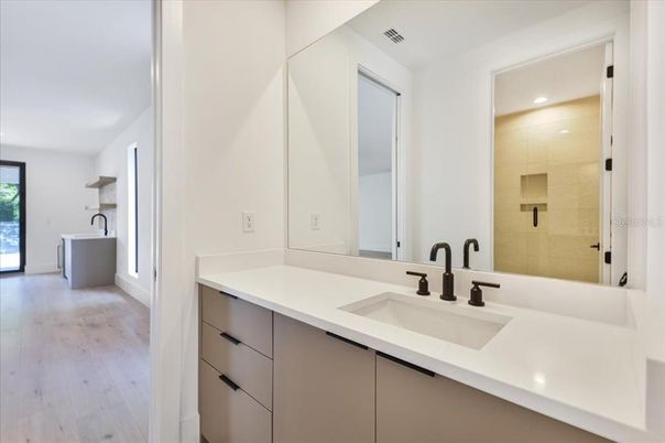 Bathroom, Dual Sink Vanities, Glass Shower, Interior, Recessed Lighting, Wood Texture Flooring