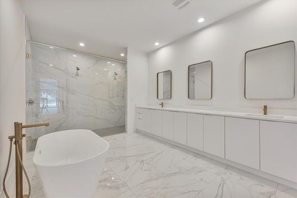 Bathroom, Dual Sink Vanities, Free Standing Baths, Interior, Marble, Marble Walls, Recessed Lighting