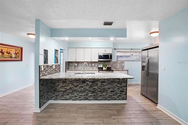 Interior, Kitchen, Recessed Lighting, Stainless Steel Appliances, Wood Texture Flooring