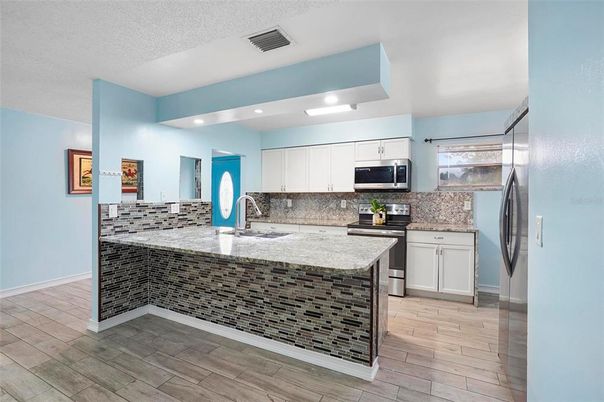 Interior, Kitchen, Recessed Lighting, Stainless Steel Appliances, Wood Texture Flooring