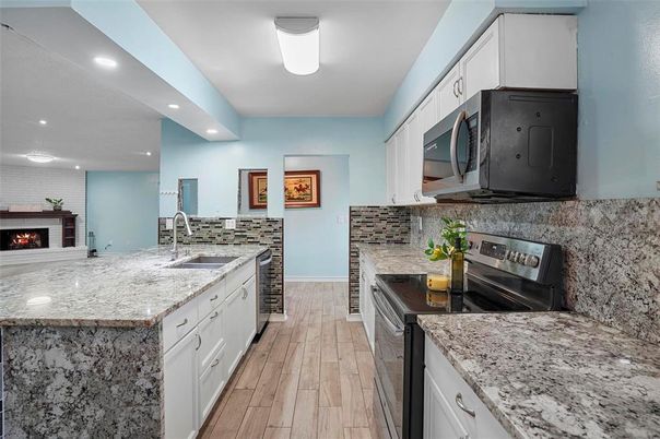 Fireplace, Interior, Kitchen, Recessed Lighting, Wood Texture Flooring