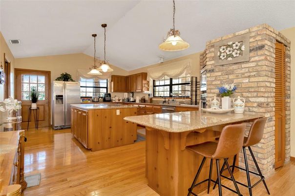 Interior, Kitchen, Pendant Lights, Stainless Steel Appliances, Stone Walls, Wood Texture Flooring