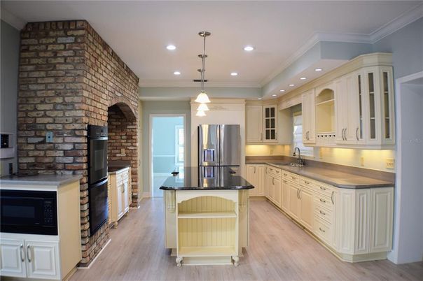 Interior, Kitchen, Pendant Lights, Recessed Lighting, Stainless Steel Appliances, Stone Walls, Wood Texture Flooring