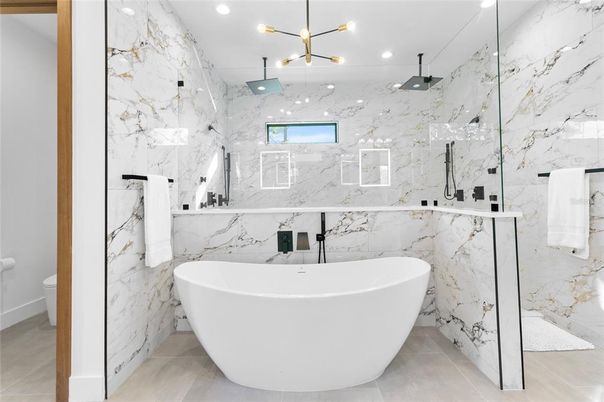 Bathroom, Free Standing Baths, Glass Shower, Interior, Marble, Marble Walls, Pendant Lights, Recessed Lighting