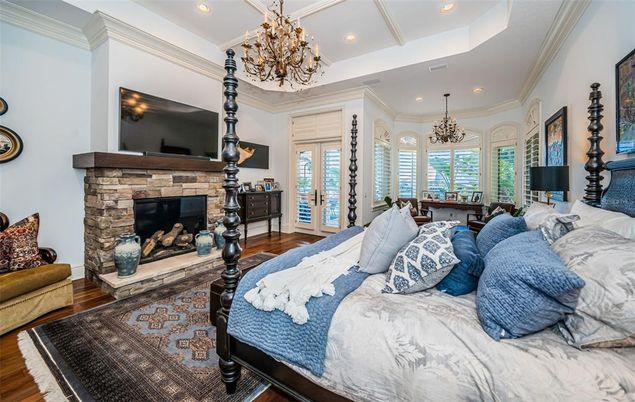 Bedroom, Chandelier, Fireplace, Interior, Recessed Lighting, Wood Texture Flooring
