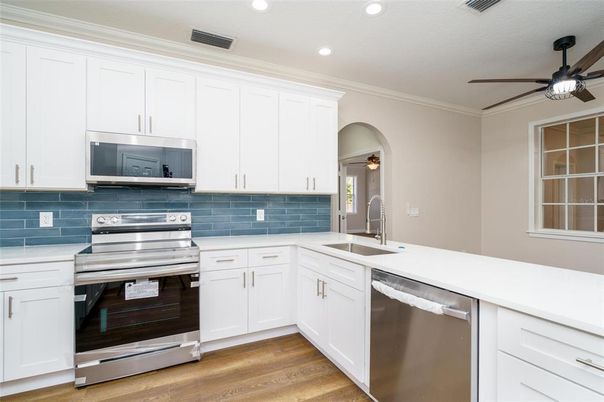 Interior, Kitchen, Recessed Lighting, Stainless Steel Appliances, Wood Texture Flooring