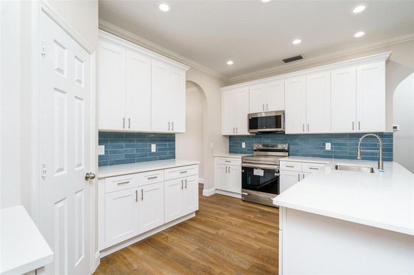 Interior, Kitchen, Recessed Lighting, Stainless Steel Appliances, Wood Texture Flooring