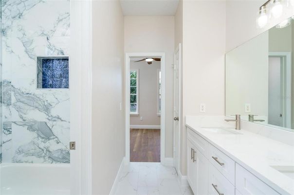 Bathroom, Dual Sink Vanities, Interior, Marble, Marble Walls, Wood Texture Flooring